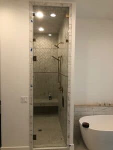 A bathroom with a tub and shower, providing a relaxing and refreshing space for personal hygiene.