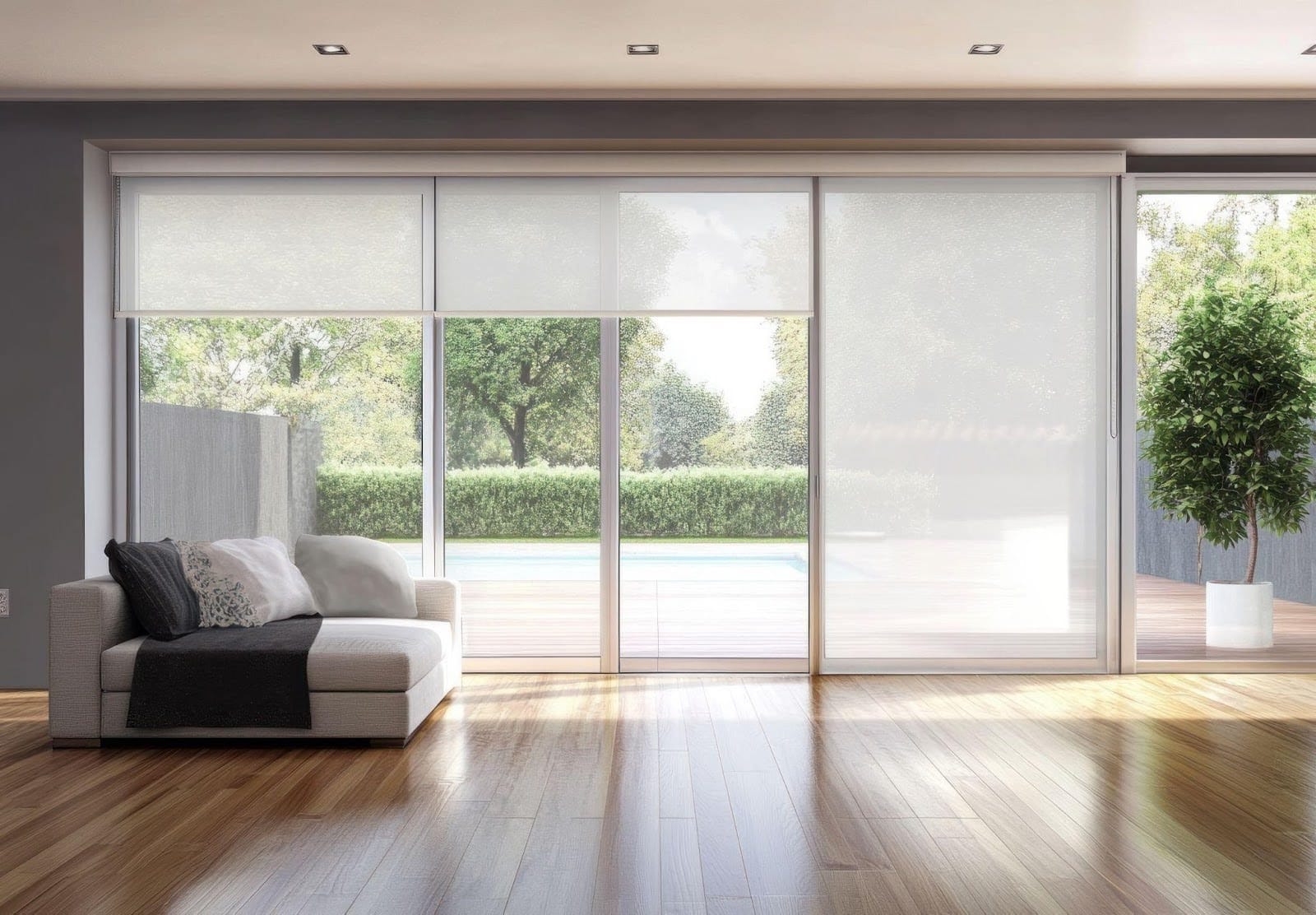 A cozy living room featuring a couch and large sliding glass doors that open to an outdoor space