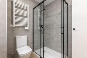 Modern bathroom featuring a sleek shower and a contemporary toilet in a minimalist design