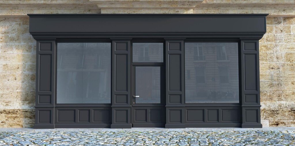 A black storefront featuring a large window and a door showcasing a modern design