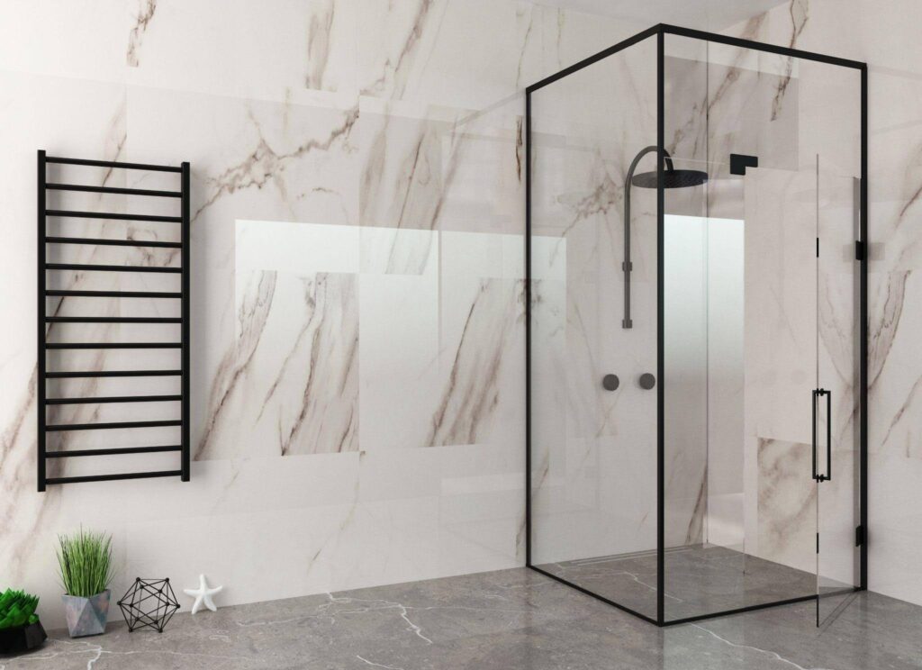 Modern bathroom interior with a glass shower enclosure and luxurious marble wall finish
